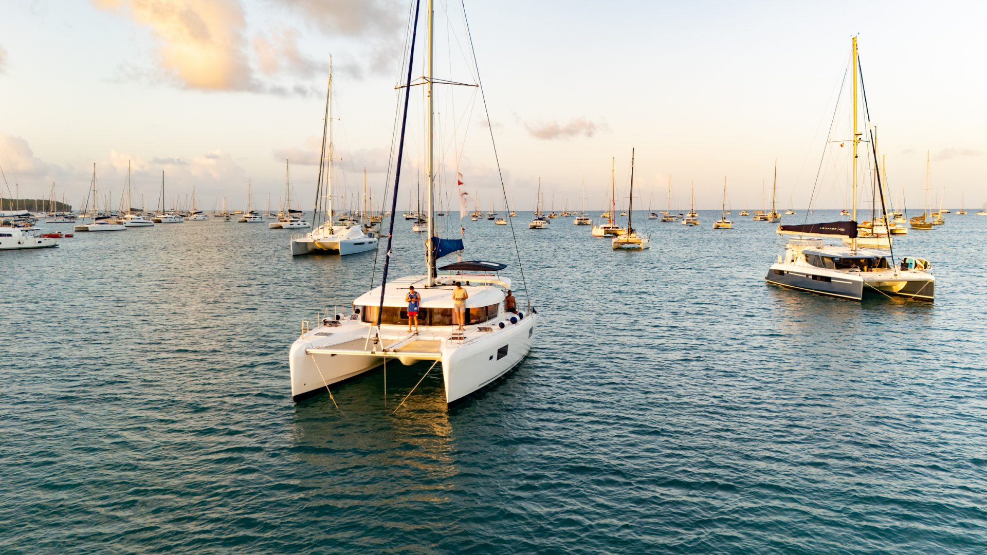 Tourists on Boats Sailing in Sea against Sky during Sunset